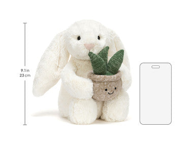 Lapin crème avec plante