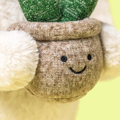 Lapin crème avec plante