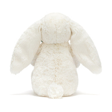 Lapin crème avec plante