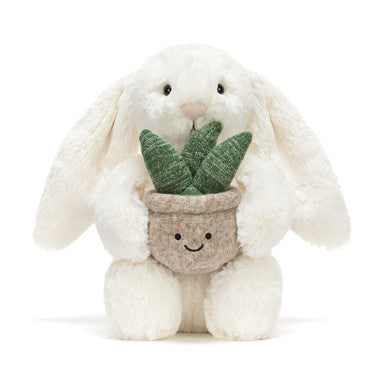 Lapin crème avec plante