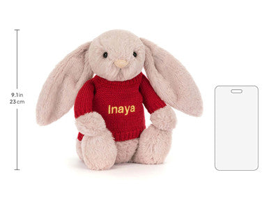 Bashful Luxe Bunny Rosa avec pull rouge personnalisé