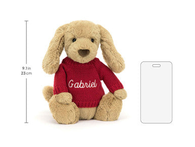 Chiot timide au caramel avec pull rouge personnalisé